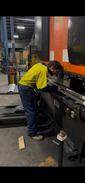The founder forming a galvanised corner bracket on a brake press